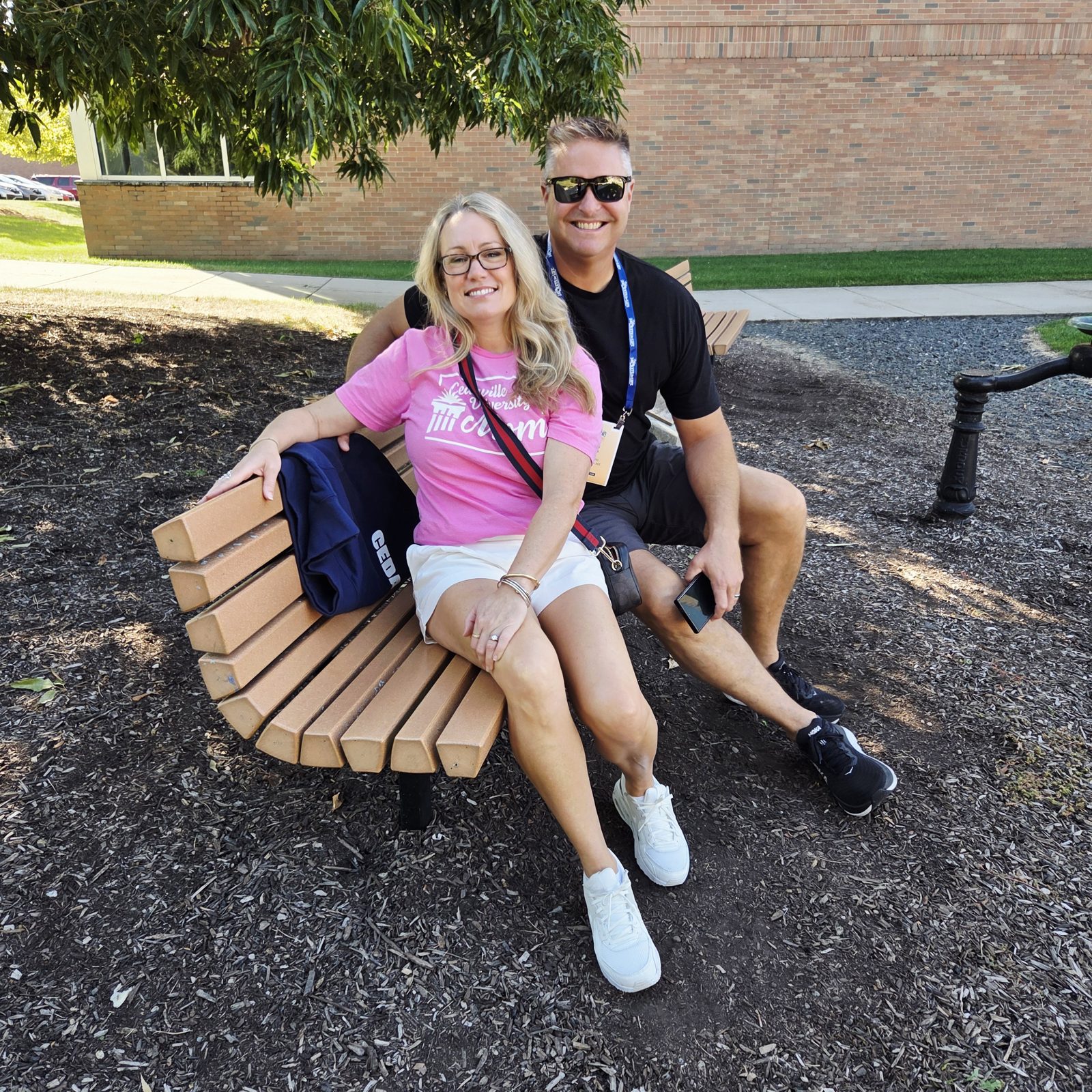 Faye and Chris Wilson sitting on a bench outside